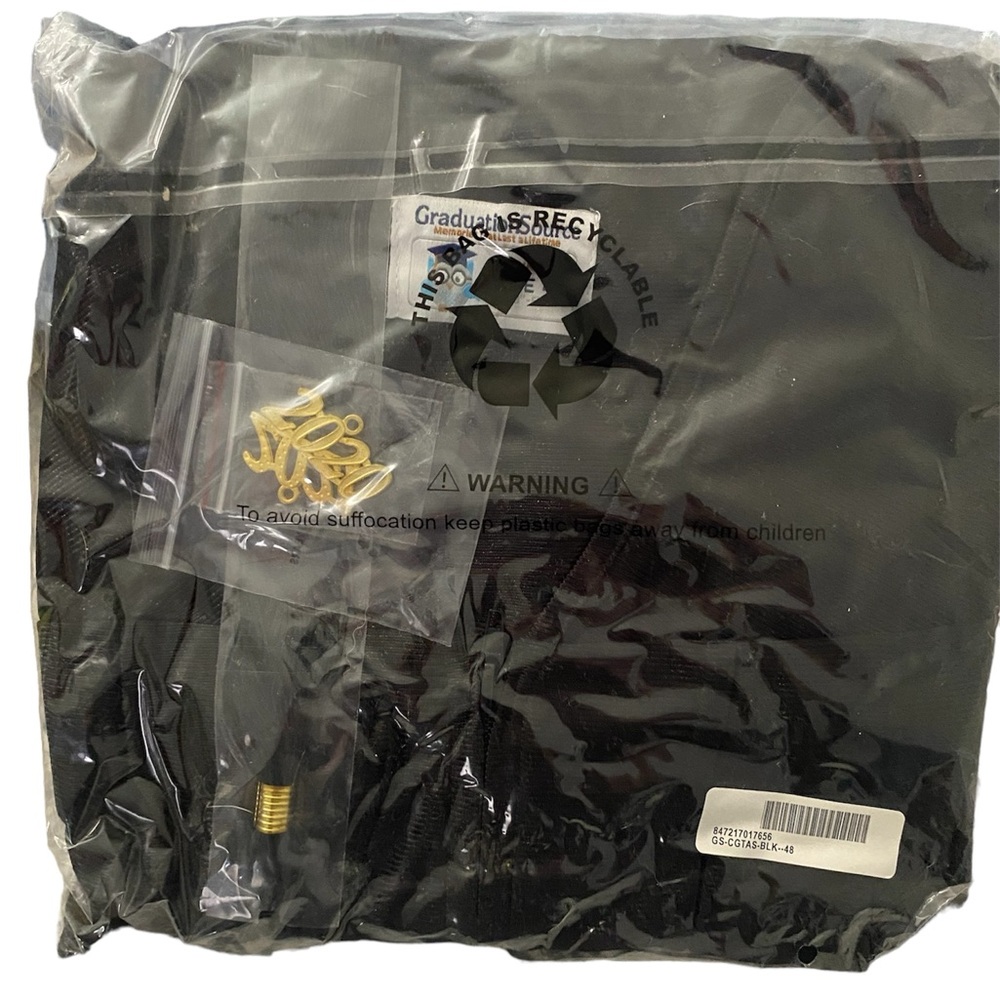 Graduation cap and gown. New in package. Size 48